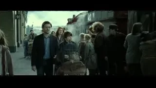 man holding birdcage on train platform — Harry Potter and the Deathly Hallows 2