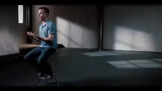 Man sitting on stool in empty concrete room — The Social Dilemma