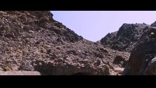 people standing in front of cave entrance — Iron Man