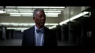Elderly man in suit standing in dim hallway — Batman: The Dark Knight