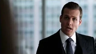 man in suit standing by window — Suits