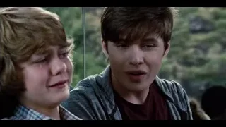 young man and woman sitting, woman crying — Jurassic World