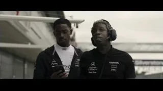 two men in Mercedes F1 jackets — F1