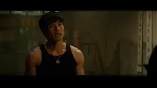 young man in dimly lit dilapidated room — Bruce Lee: Birth of The Dragon