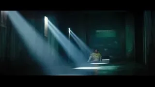 person sitting in a dark abandoned room — Deadpool 2