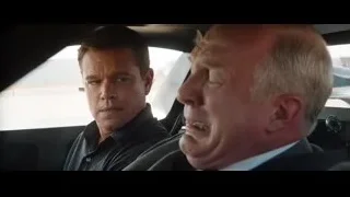 two men sitting in back of car — Ford v Ferrari