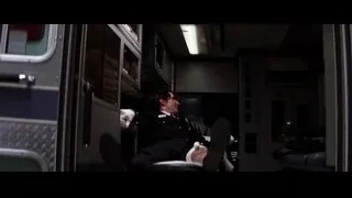 man in suit sitting on train — Batman: The Dark Knight