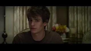 young man deep in thought on couch — The Amazing Spider Man