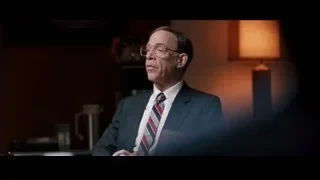 middle-aged man in suit gesturing — Jobs