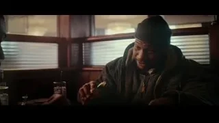 Man in beanie at dimly lit restaurant — Creed 3