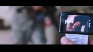 person holding phone displaying man's face — Iron Man