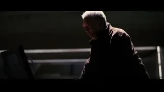 Elderly man in dimly lit room — Batman: The Dark Knight Rises