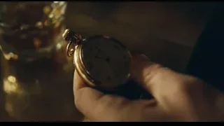 hand holding pocket watch over whiskey glass — Peaky Blinders
