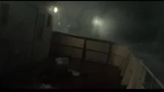 Person standing on wooden bridge at night — Life of Pi