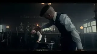 Man in suit adjusting jacket in dark room — Peaky Blinders