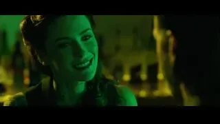 Close-up of woman's face in dim room — John Wick