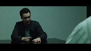 man deep in thought at table in dimly lit room — Fight Club