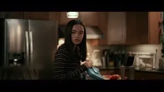 young woman in kitchen holding kettle — The Social Dilemma