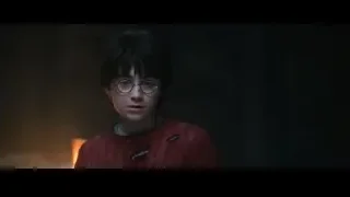 Harry Potter in red sweater by burning fire — Harry Potter and the Philosophers Stone