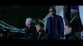 Men looking at telescope at night — Now You See Me 2