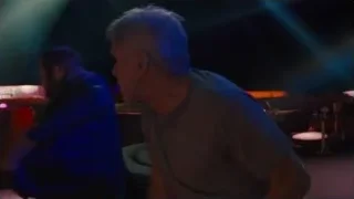 two men in dimly lit room with bar — Blade Runner 2049