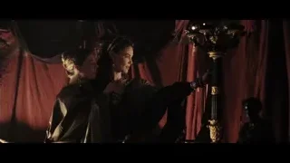 Two medieval women with candelabra in dim room — Gladiator