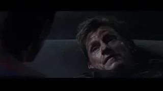close-up of man's bloody face in dark room — The Amazing Spider Man 2