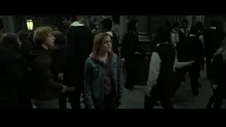 People in formal attire walking down staircase — Harry Potter and the Deathly Hallows 2