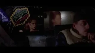 Man in car looking at screen — American Psycho