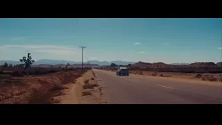 Car driving through desert landscape — La La Land