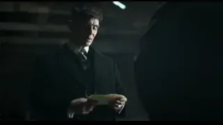 man holding paper in dark room — Peaky Blinders