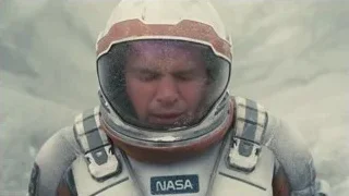 Man in NASA suit in snowy landscape — Interstellar