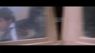 Man in suit walking towards burning car — Iron Man