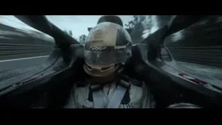 Person in race car cockpit wearing helmet — F1