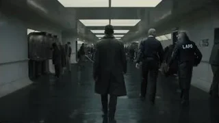 people walking in long LAPD corridor — Blade Runner 2049