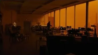 Person working in dimly lit workshop — Blade Runner 2049
