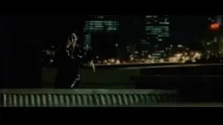 man sitting on bench in dark city — The Matrix