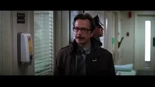 Man with mustache walking past Emergency Room — Batman: The Dark Knight
