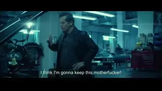 man in leather jacket in garage — John Wick