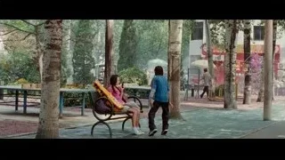 Girl sitting on park bench with man standing — The Karate Kid