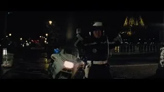 police officer by motorcycle on city street — Now You See Me