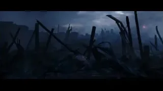 person in destroyed cityscape at night — Deadpool