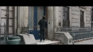 young man on steps holding phone — Spiderman: No Way Home
