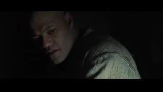 man's serious face in dark — The Matrix