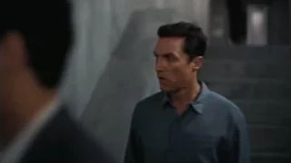 two men in dimly lit concrete hallway — Interstellar