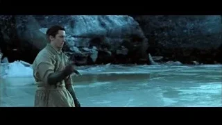 man holding sword by rocky cliff — Batman