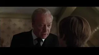 older man talking to young woman — Batman