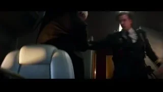 Man holding gun in dimly lit room — The Amazing Spider Man 2