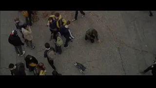 people kneeling on street with backpacks — The Amazing Spider Man