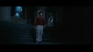 young man on stone stairs in dark room — Harry Potter and the Philosophers Stone